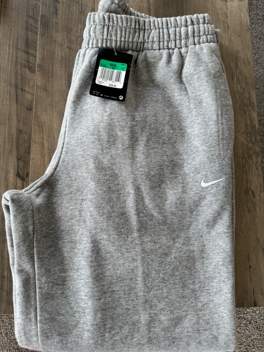 Nike Grey Men’s Fleece sweatpants with White Swoosh